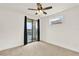 Bedroom featuring a ceiling fan, sliding door to a patio, and bright windows at 13169 Bromborough Dr, Orlando, FL 32832