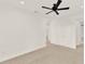 Bright hallway with a ceiling fan, neutral carpeting, and white trim at 13169 Bromborough Dr, Orlando, FL 32832