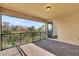 Covered patio with brick floor and a black metal railing overlooking a natural area at 13169 Bromborough Dr, Orlando, FL 32832