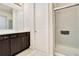 Bathroom featuring a vanity with modern fixtures and a glass-enclosed shower stall at 132 Lake Smart Cir, Winter Haven, FL 33881