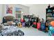 Bedroom is decorated with a large bed and a shelves full of toys at 132 Lake Smart Cir, Winter Haven, FL 33881