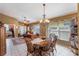 Dining area with neutral colors and a traditional chandelier at 13209 Wild Duck Ct, Orlando, FL 32828