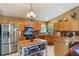 Well-lit kitchen with stainless steel appliances and granite countertops at 13209 Wild Duck Ct, Orlando, FL 32828