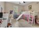 Whimsical ' bedroom with loft bed, play area and light wood floors at 13330 Meergate Cir, Orlando, FL 32837