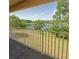 Balcony with views of lush greenery and a lake at 13941 Fairway Island Dr # 733, Orlando, FL 32837