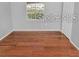 Empty bedroom with laminate flooring, a window, and a closet at 13941 Fairway Island Dr # 733, Orlando, FL 32837