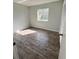 Cozy bedroom with updated flooring, natural light, and closet at 1542 Colony Ave, Kissimmee, FL 34744