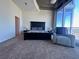 Main bedroom with nice view, gray accent chair, and carpet at 155 S Court Ave # 2904-Penthouse, Orlando, FL 32801