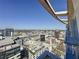 Stunning aerial view of the cityscape from the balcony with clear blue skies at 155 S Court Ave # 2904-Penthouse, Orlando, FL 32801