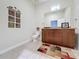 Well-lit half bathroom with ceramic tile flooring, granite counter and artistic wall decor at 155 S Court Ave # 2904-Penthouse, Orlando, FL 32801