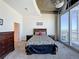 Bedroom features carpet, ceiling fan and a balcony with a great city view at 155 S Court Ave # 2904-Penthouse, Orlando, FL 32801