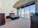 Bedroom features carpet, ceiling fan and a balcony with a city view at 155 S Court Ave # 2904-Penthouse, Orlando, FL 32801