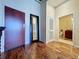 Entry hallway featuring a door and access to the bathroom and closet at 155 S Court Ave # 2904-Penthouse, Orlando, FL 32801