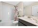 Functional bathroom with a shower-tub combo, patterned shower curtain, and sleek vanity at 1585 Plunker, Davenport, FL 33896