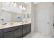 Bathroom features dual sinks, granite counters, and modern fixtures at 1585 Plunker, Davenport, FL 33896