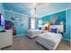 Themed bedroom with 'Finding Nemo' decor, playful accents, and two twin beds at 1585 Plunker, Davenport, FL 33896