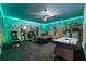 Spacious game room with custom murals, lighting and room to play at 1585 Plunker, Davenport, FL 33896