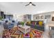 Spacious living room with an open concept, featuring a colorful rug and dining area at 1585 Plunker, Davenport, FL 33896