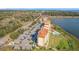 An elevated aerial view showing the pool, parking and exterior of the condo building at 16300 County Road 455 # 712, Montverde, FL 34756