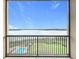 Balcony with view of lake, pool, and landscaped grounds at 16300 County Road 455 # 712, Montverde, FL 34756