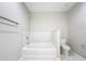 Clean bathroom featuring large soaking tub, toilet, and neutral finishes at 16300 County Road 455 # 712, Montverde, FL 34756