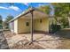 Backyard view highlighting the home's exterior with a patio area at 1765 W Schwartz Blvd, Lady Lake, FL 32159