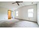 Bedroom with light walls, and a vaulted ceiling at 1765 W Schwartz Blvd, Lady Lake, FL 32159