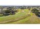 Scenic aerial view of the golf course with lush green fairways at 1765 W Schwartz Blvd, Lady Lake, FL 32159