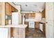 Spacious kitchen featuring wooden cabinets and white appliances at 1765 W Schwartz Blvd, Lady Lake, FL 32159