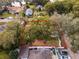 A high aerial view of the home's neighborhood, showcasing its mature trees and property outline at 1801 Chamberlin St, Orlando, FL 32806