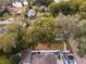 A high aerial view of the home's neighborhood, showcasing its mature trees at 1801 Chamberlin St, Orlando, FL 32806