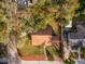 A high aerial view of the home, showcasing its mature trees and property outline at 1801 Chamberlin St, Orlando, FL 32806