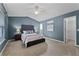 Primary bedroom with vaulted ceiling, en suite bath, and walk-in closet at 1801 Chamberlin St, Orlando, FL 32806