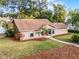 Aerial view of a single-story home with well-maintained landscaping and a spacious yard at 1801 Chamberlin St, Orlando, FL 32806