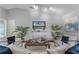 Stylish living room with hardwood floors, modern furniture, and a vaulted ceiling at 1801 Chamberlin St, Orlando, FL 32806