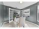 Home office featuring french doors, neutral walls, carpet, and a table and chair setup at 1801 Chamberlin St, Orlando, FL 32806