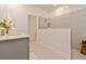 Bathroom featuring a glass shower and double sinks at 1908 Perch Hammock Loop, Groveland, FL 34736