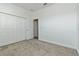 Bright bedroom features neutral carpet and a closet at 1908 Perch Hammock Loop, Groveland, FL 34736