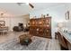 View of living space featuring a large decorative hutch and neutral tones at 1908 Perch Hammock Loop, Groveland, FL 34736