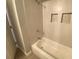 Bathroom featuring a shower and bathtub combo with tiled walls and accents at 1932 Lake Atriums Cir # 77, Orlando, FL 32839