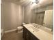 Bathroom featuring a modern vanity and large mirror at 1932 Lake Atriums Cir # 77, Orlando, FL 32839