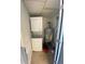 Small laundry room with washer, dryer, and water heater at 1932 Lake Atriums Cir # 77, Orlando, FL 32839