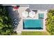 Aerial view of a modern home, showcasing a backyard pool and outdoor lounging area at 2010 Hoffner Ave, Belle Isle, FL 32809