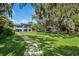 An expansive backyard provides ample space for outdoor activities and relaxation at 2010 Hoffner Ave, Belle Isle, FL 32809