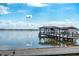 Waterfront view of private dock featuring boat house and lifts at 2010 Hoffner Ave, Belle Isle, FL 32809