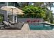 Modern pool and outdoor lounging area with umbrellas at 2010 Hoffner Ave, Belle Isle, FL 32809