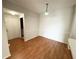 Dining room area featuring wood floors, soft lighting, and wall trim accents at 2013 Tizewell Cir # 1408, Orlando, FL 32837