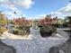 Landscaped garden area with symmetrical design, water feature and community buildings at 2013 Tizewell Cir # 1408, Orlando, FL 32837