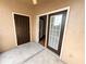 Outdoor patio area with a sliding glass door and a regular door at 2013 Tizewell Cir # 1408, Orlando, FL 32837