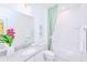 Bright bathroom featuring stylish decor, vanity, and a shower with soaking tub at 2560 Shanti Dr, Kissimmee, FL 34746